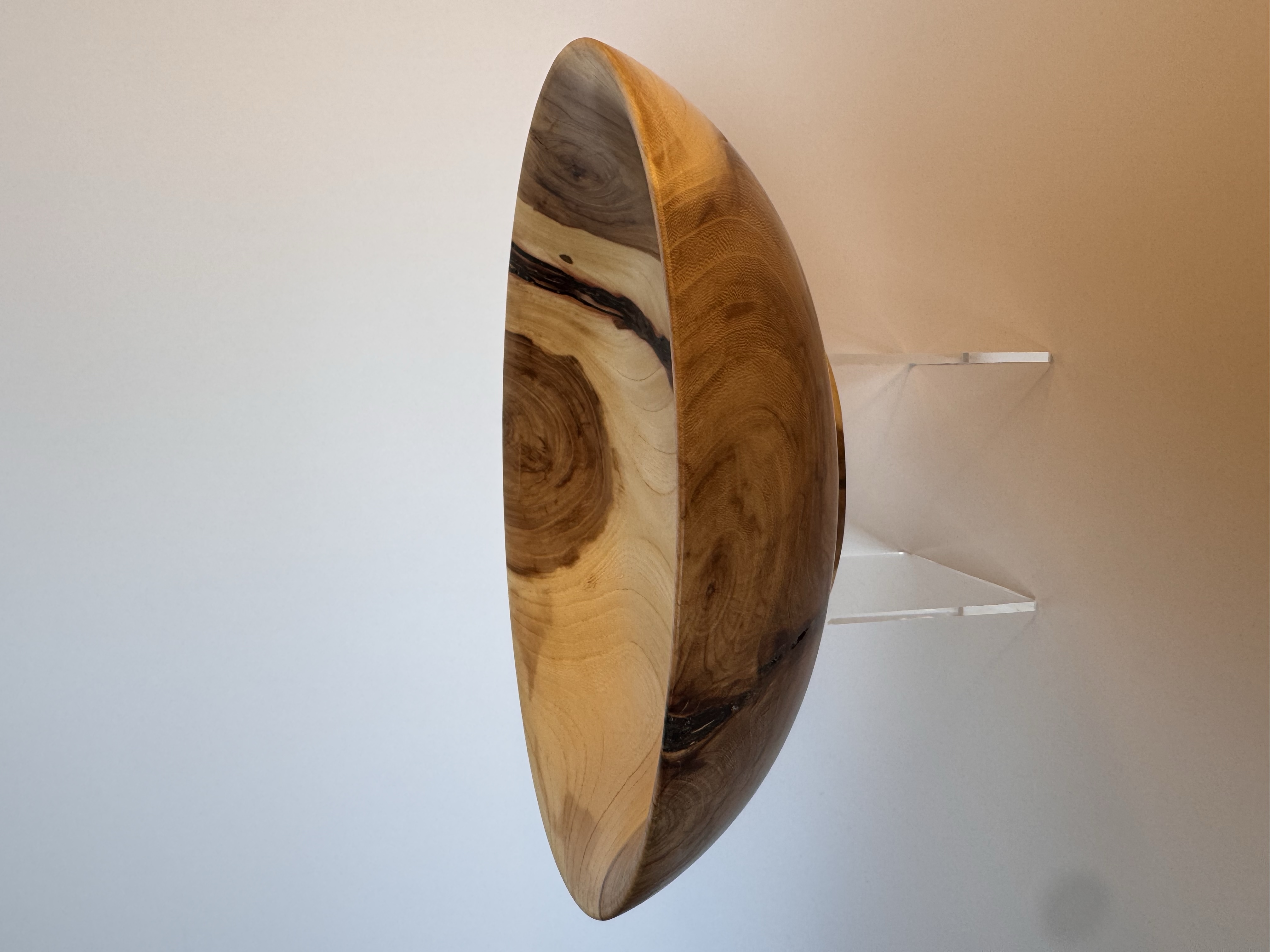Side view of low apple wood bowl showing natural bark inclusion