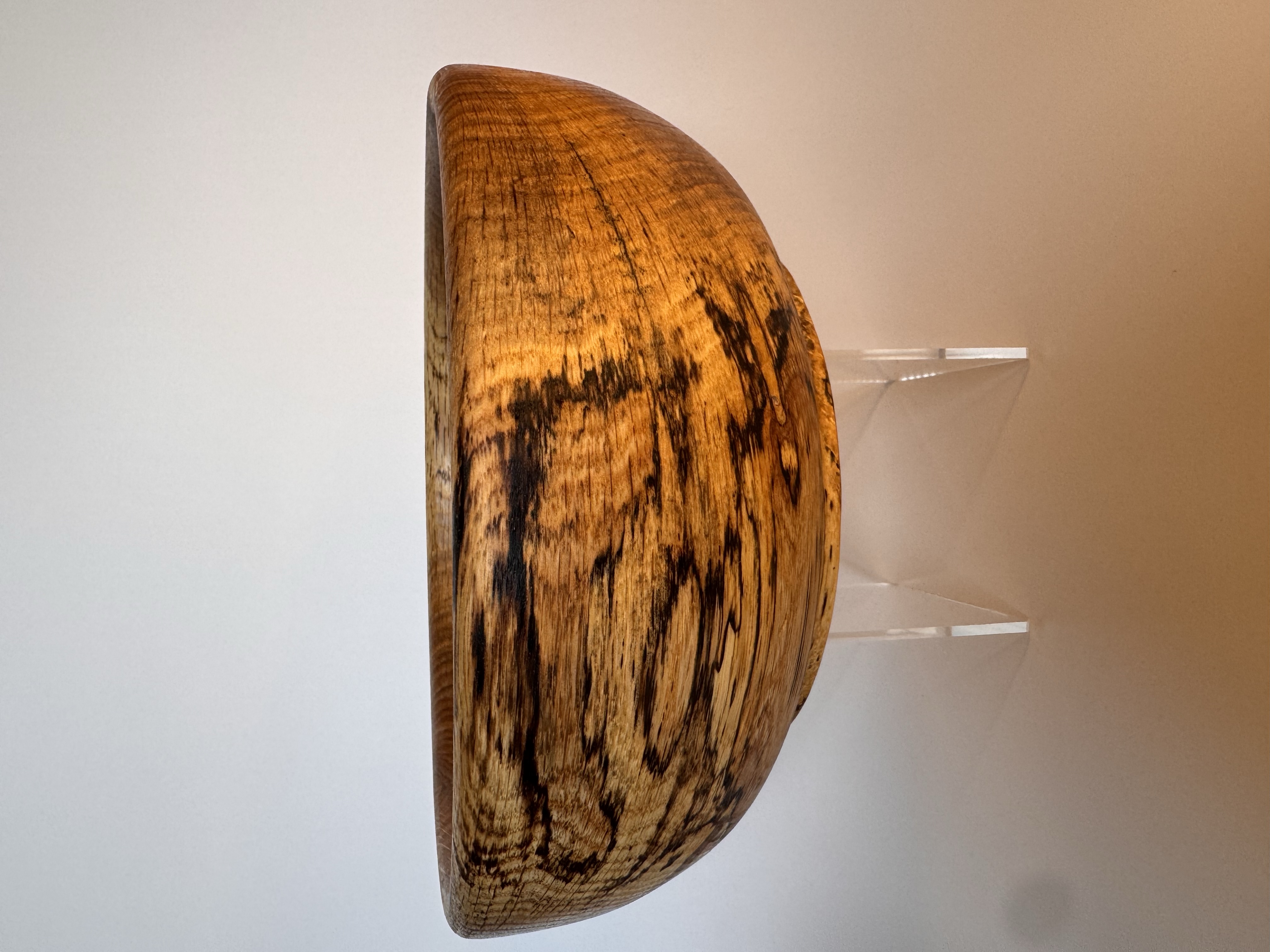 Side view of a hand-turned spalted oak bowl